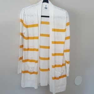 White with yellow stripped cardigan.